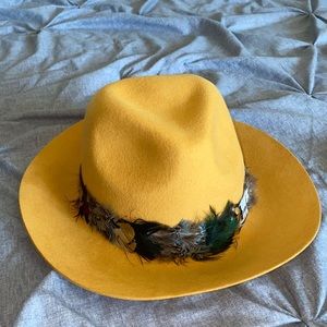 Mustard yellow fedora with feathers